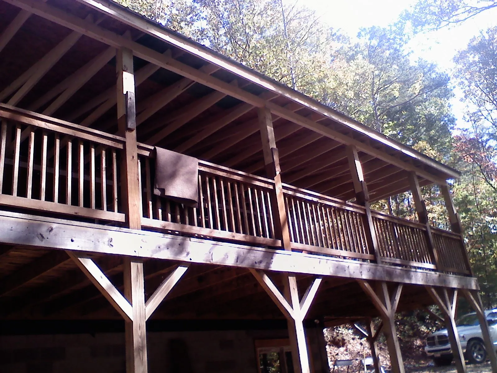 Timber framing under a new elevated porch and deck — Roof Leak Repair in Le Claire by Roofing Brothers
